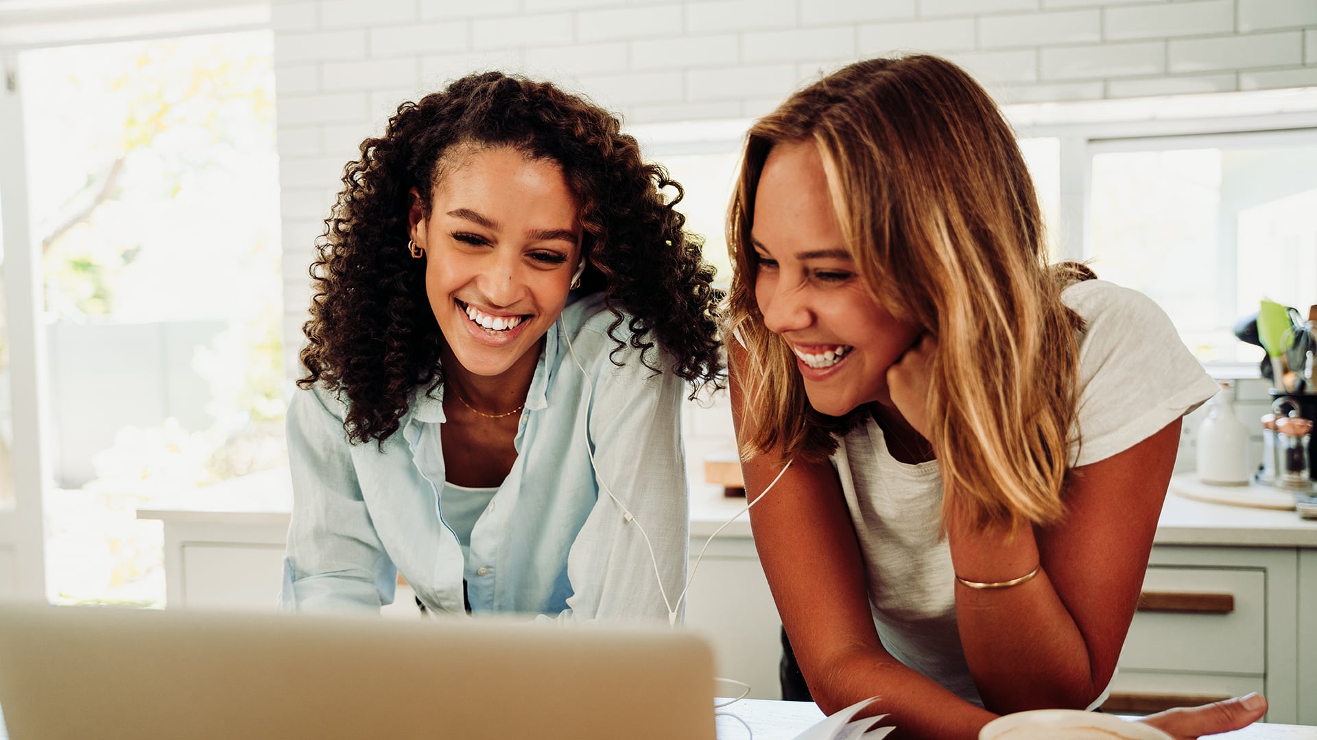 Two women joyfully working